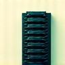 Icon of a server rack with a green energy leaf inside