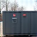 A reliable, quiet backup generator unit in an industrial setting.