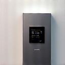 A compact, modern smart inverter box with indicator lights.