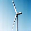 Sleek, modern wind turbines rotating gracefully against a horizon.